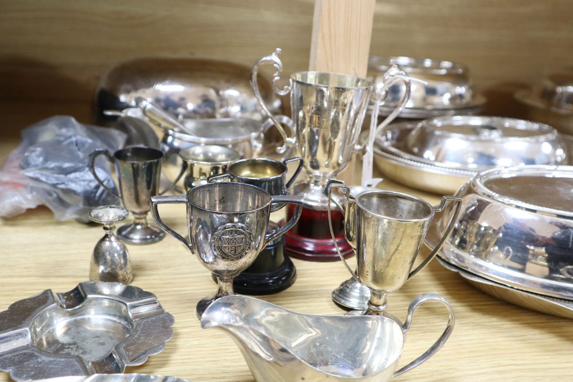 A quantity of plated items, including entree dishes and covers,